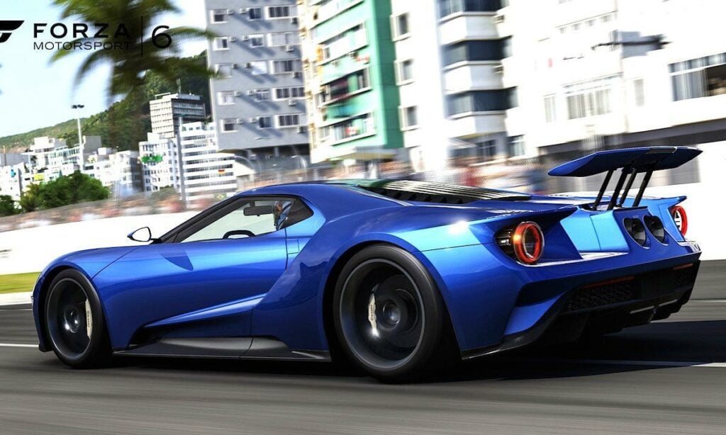 En blå Ford GT kör på en racebana. (AI text)