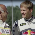 En man och en kvinna i Red Bull-raceutrustning (AI text)