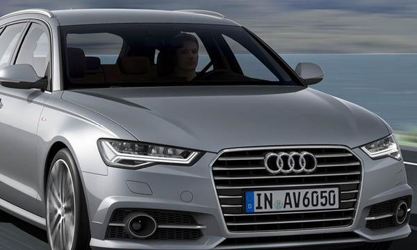 Audi A6 kör längs vägen (AI text)
