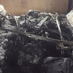 En bil bränd i garaget (AI text)