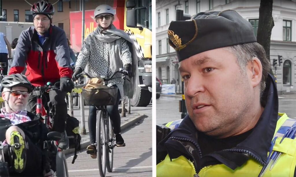 En polis talar med en kvinna som cyklar. (AI text)