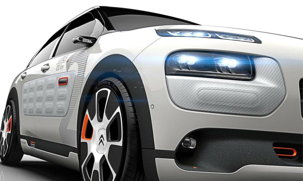 En vit bil med ett rött ljus på den. (AI text)