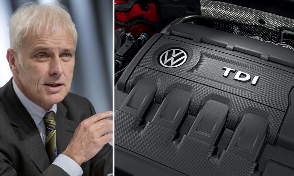 En man i kostym och slips står bredvid en bilmotor. (AI text)