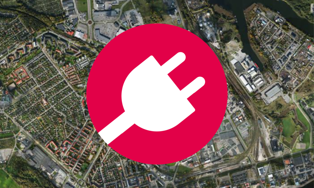 En stad med ett rött och vitt billogo. (AI text)