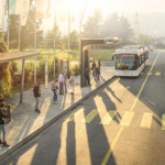 En stadsgata med en busshållplats och ett bil. (AI text)