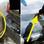 En man reparar en bil. (AI text)