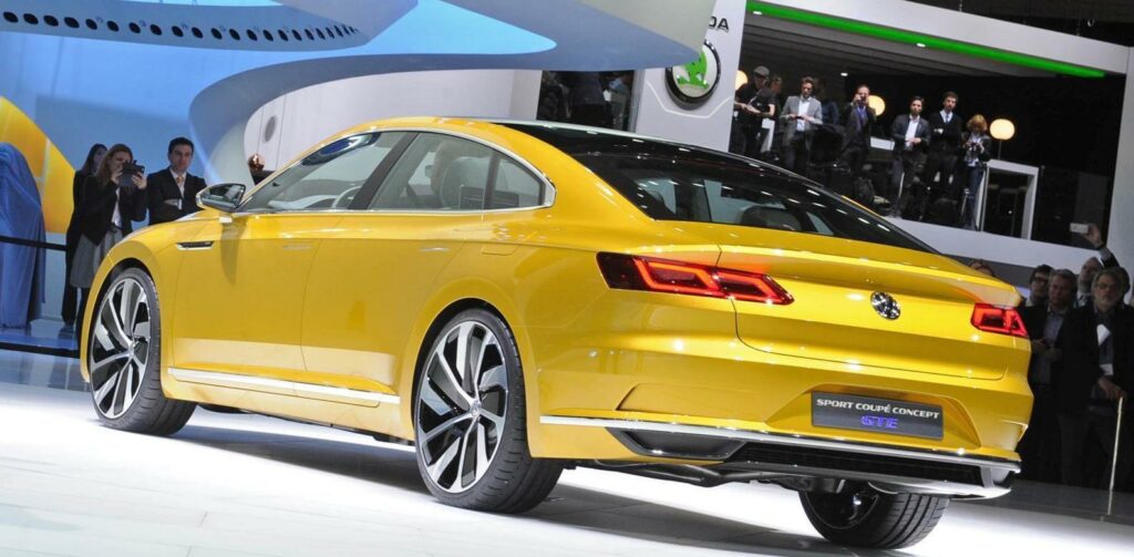 En gul Volkswagen C3 Concept-bil utställd på Detroit Auto Show. (AI text)