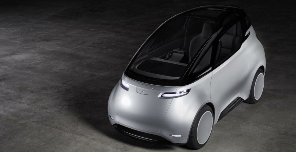 En futuristisk bil i en mörk utrymme. (AI text)