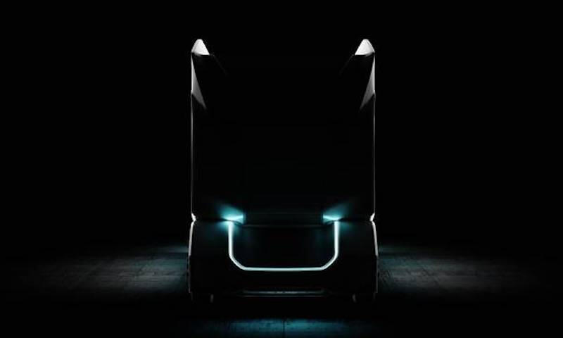 Tesla-lastbil i mörka natten (AI text)