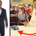 En man och en kvinna står bredvid en bil. (AI text)