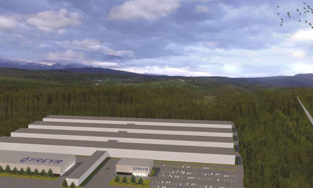 En avbildning av en fabrik med ett stort byggnad i bakgrunden. (AI text)