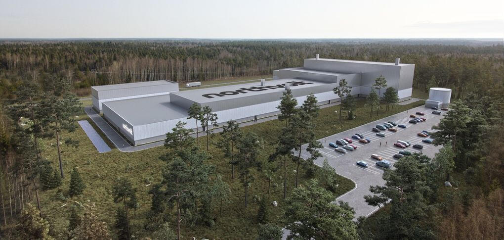 En återgivning av ett stort byggnad i skogen. (AI text)