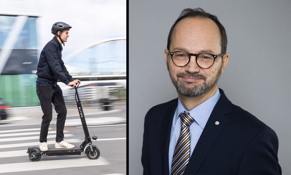 En man cyklar på en elcykel, medan en annan man står bredvid i kostym. (AI text)