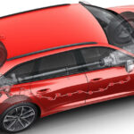 En röd bil med en grönt motor. (AI text)