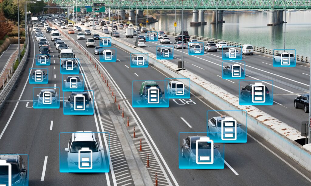 En grupp bilar på en motorväg med en blå lampa på dem. (AI text)