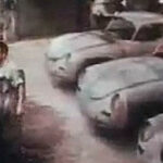 En grupp personer i en garage. (AI text)