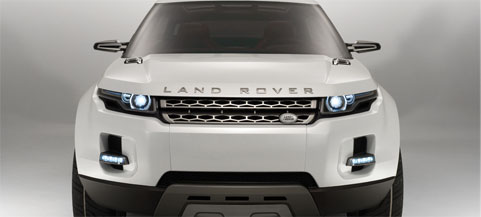 En vit Land Rover SUV i en studioscen. (AI text)