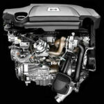 En bilmotor visas i bilden. (AI text)