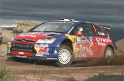 En rallybil kör på en grusväg. (AI text)