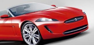 En röd jaguar XKR roadster (AI text)