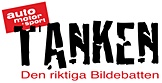 En bil med orden "Tanken" på den. (AI text)
