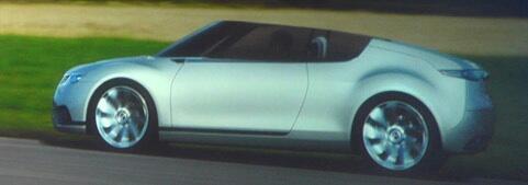 En konceptbil kör längs en väg. (AI text)