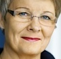 En kvinna i glasögon och svart skjorta (AI text)