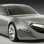 En silverfärgad bil med futuristisk design. (AI text)