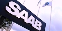 Saab-logotypen framför ett byggnad. (AI text)