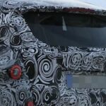 nybildade bmw i3 fotad i snön (AI text)