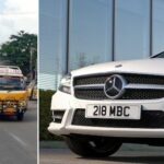 En Mercedes-Benz GLS parkerad framför ett byggnad och en indisk flagga. (AI text)