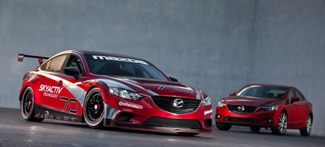 Två Mazda-bilar i en garage. (AI text)