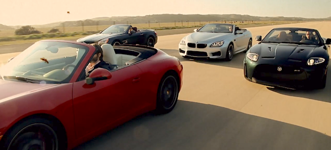 En grupp bilar kör nedför en väg. (AI text)