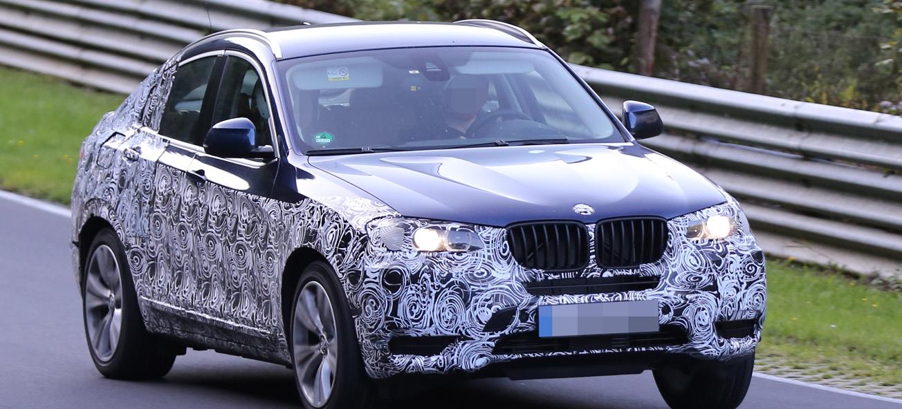 BMW X6-terrängbilen kör på en bana. (AI text)