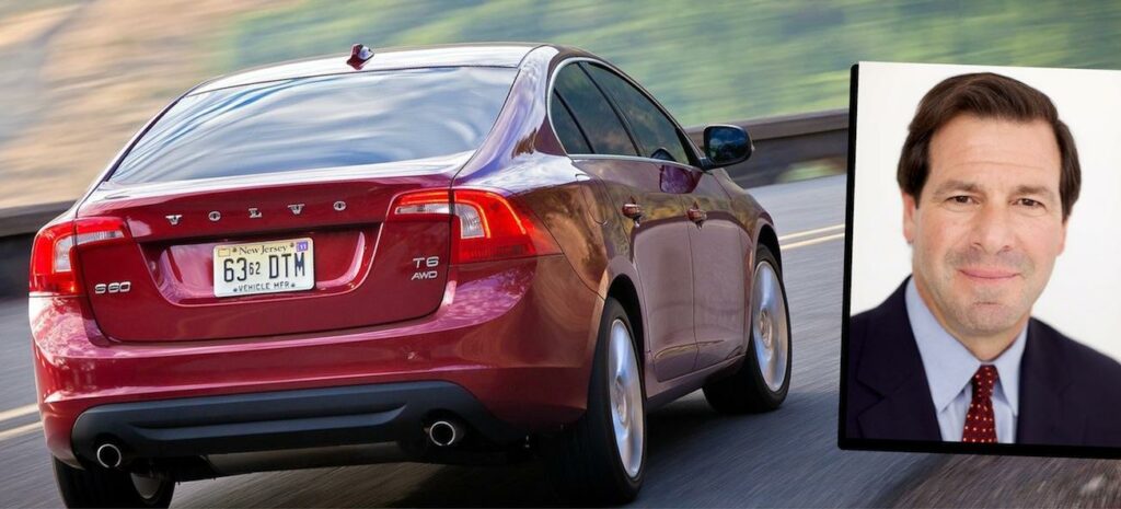 En man kör en bil och en bild av en bil. (AI text)