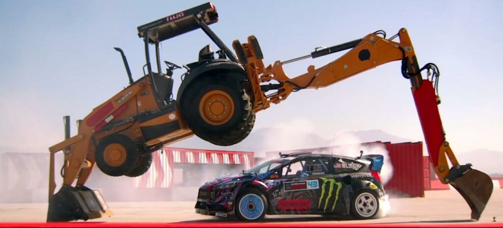 En bil lyfts av en jordförskovare. (AI text)