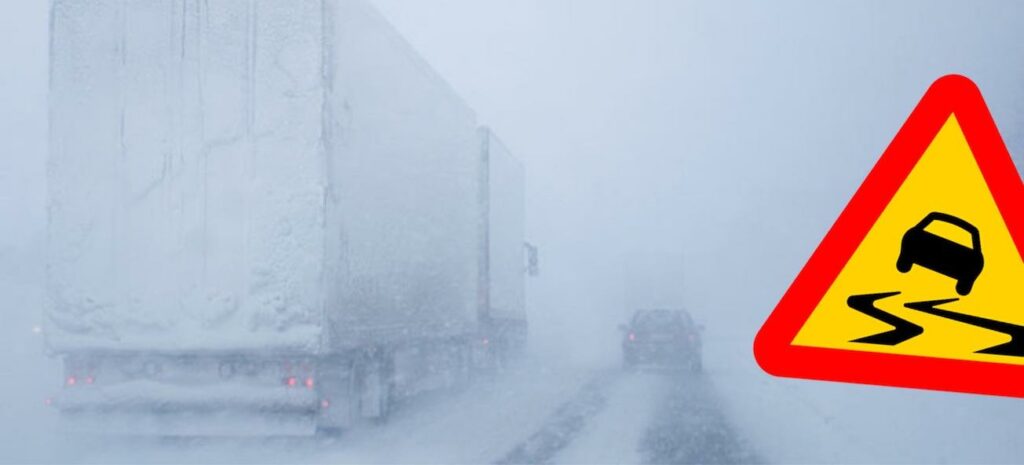 En lastbil kör på en snötäckt väg med en varningsskylt. (AI text)