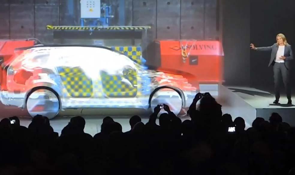 En bil visas på en scen. (AI text)