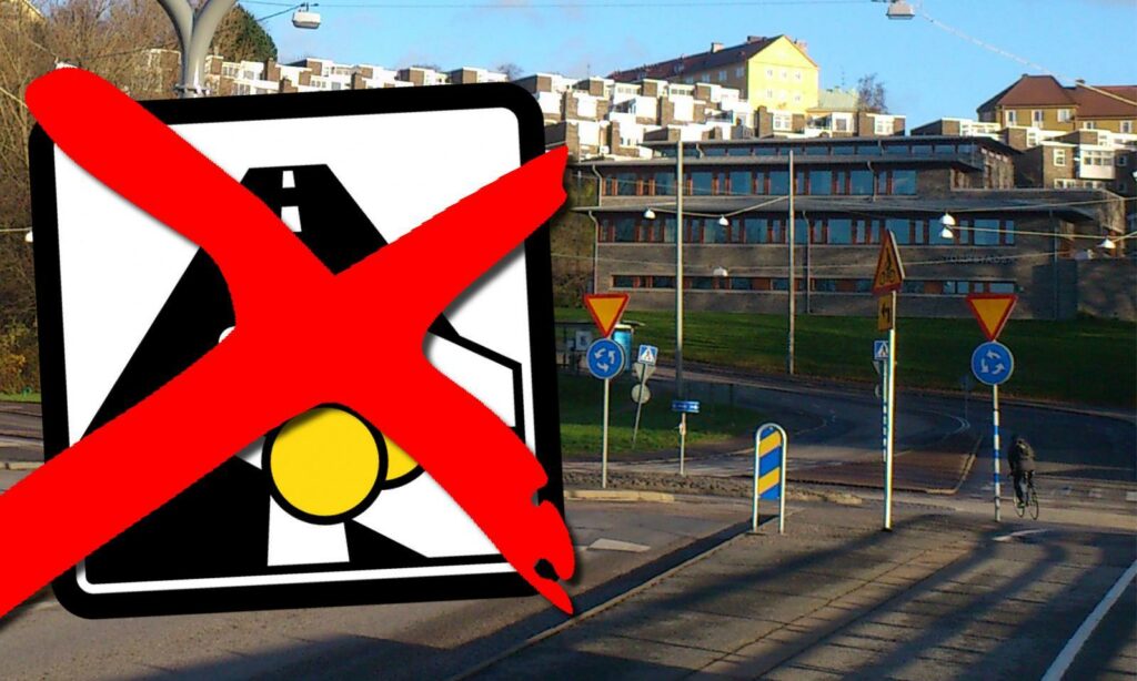 En skylt som säger nej till bilar i en stad. (AI text)