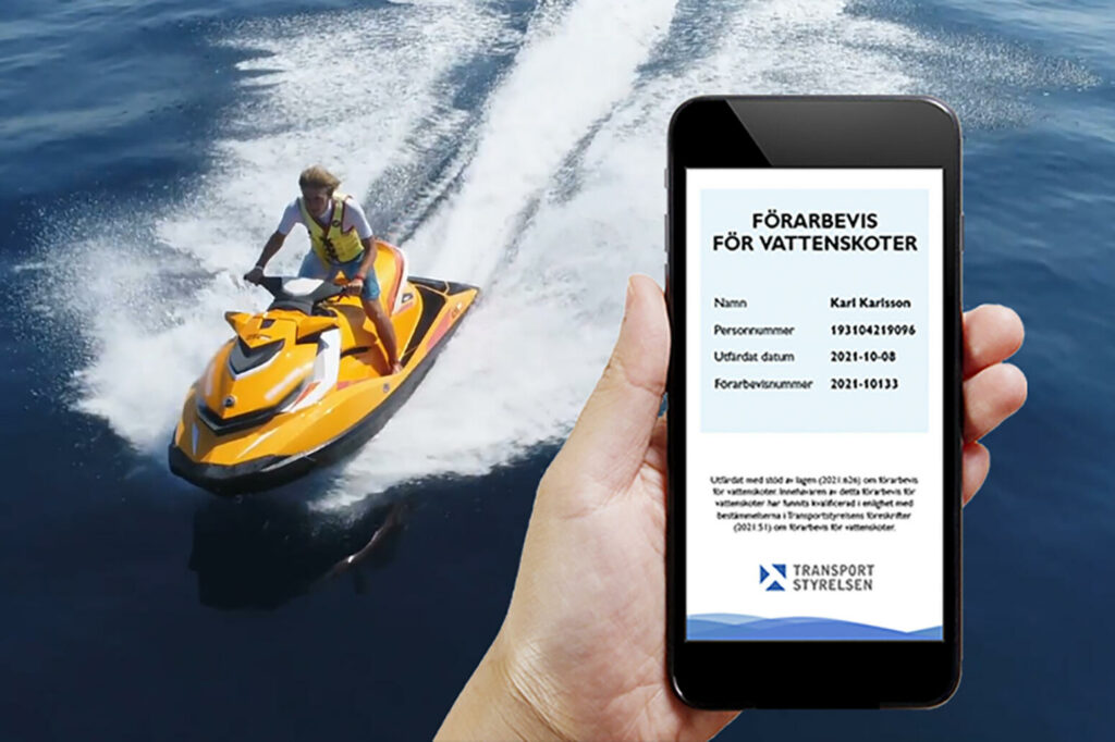 En person håller i en smartphone med en jet skidapp öppen på skärmen. (AI text)