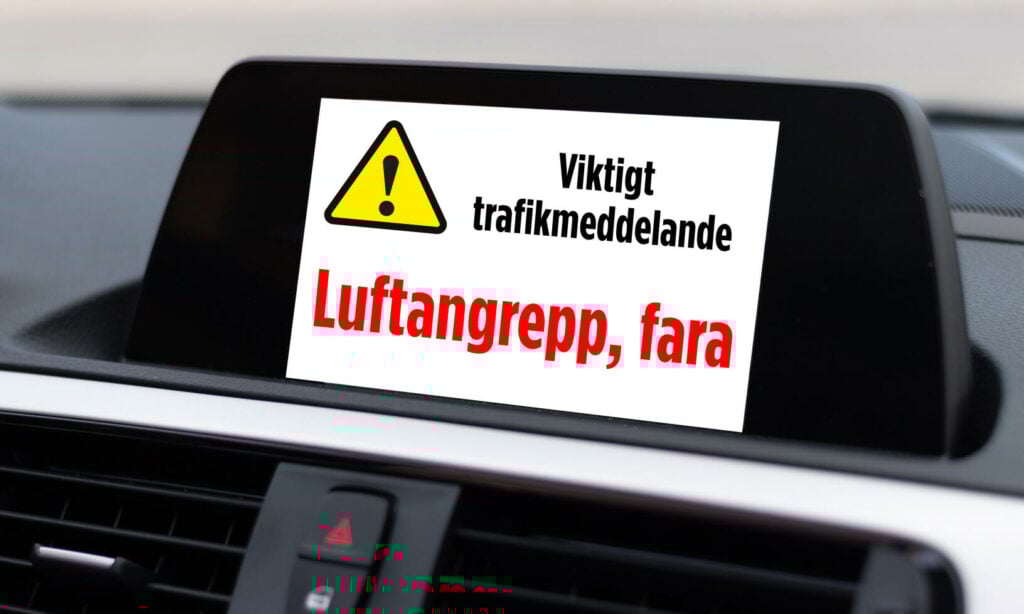 En bil med en varningsskylt på instrumentbrädan (AI text)