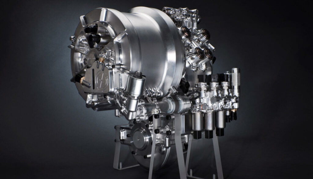 En silverfärgad motor på en svart bakgrund. (AI text)