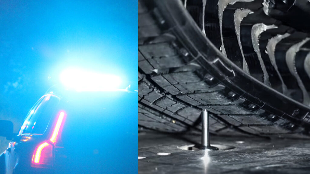 En polisbil med pågående blåljus och en däck på marken. (AI text)