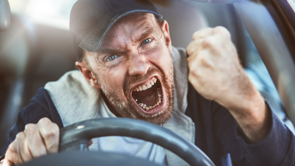 En man kör en bil. (AI text)