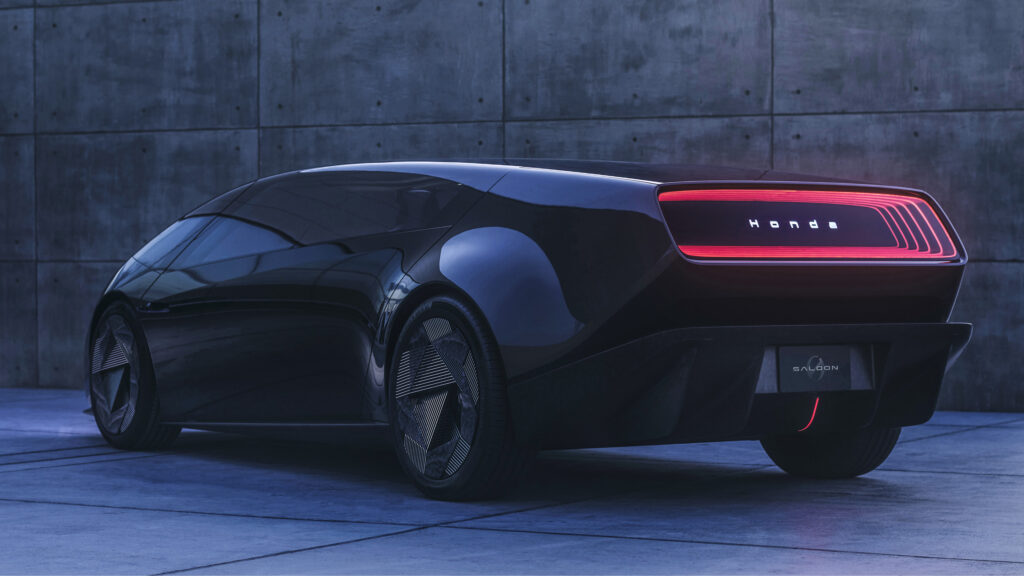 En futuristisk bil parkerad framför ett byggnad. (AI text)