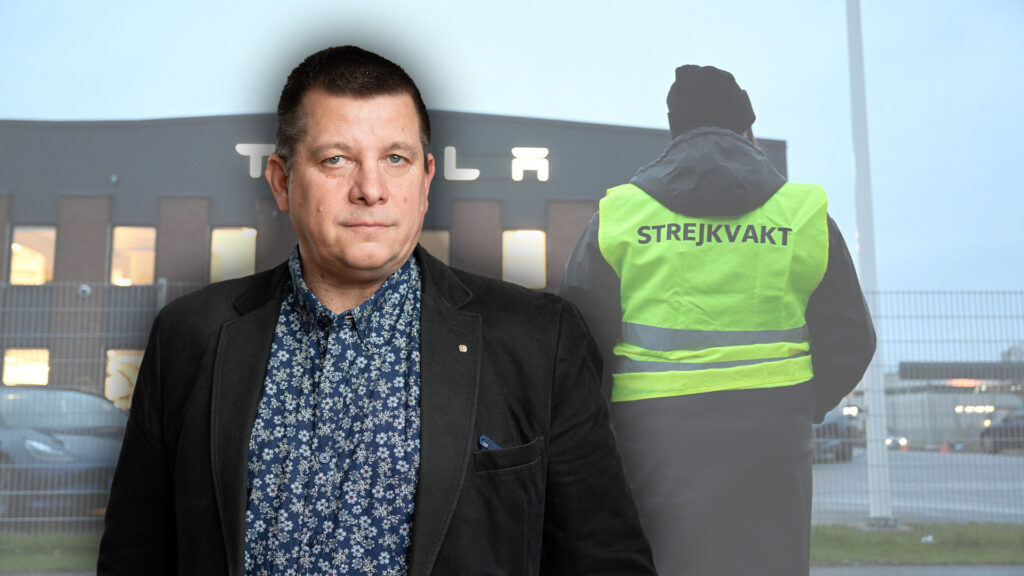 En man i väst står framför ett byggnad. (AI text)