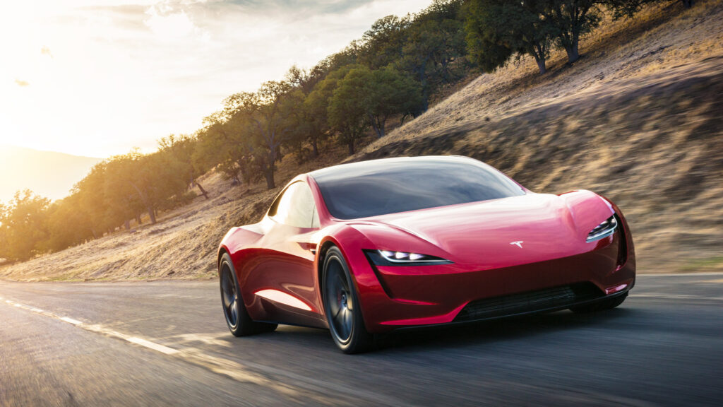 Tesla:s nya konceptbil kör nerför en bergväg (AI text)