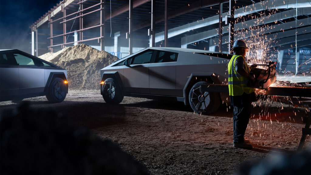 En arbetare svetsar en bil i en fabrik. (AI text)