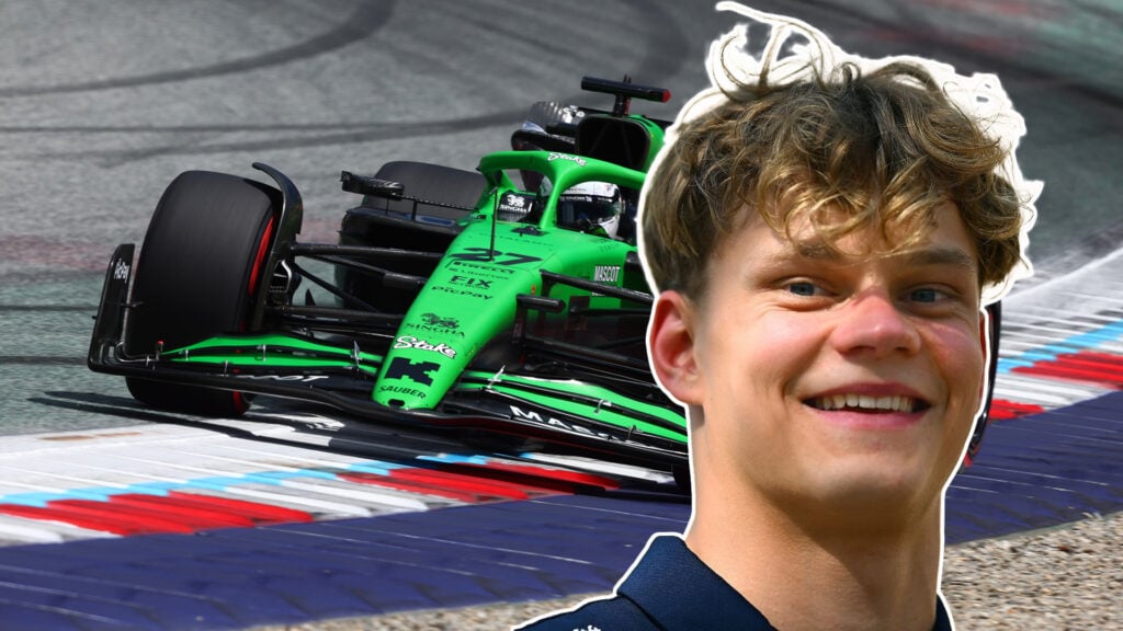 Nico Hulkenbergs Sauber-bil i bakgrunden med Paul Aron infälld framför.
