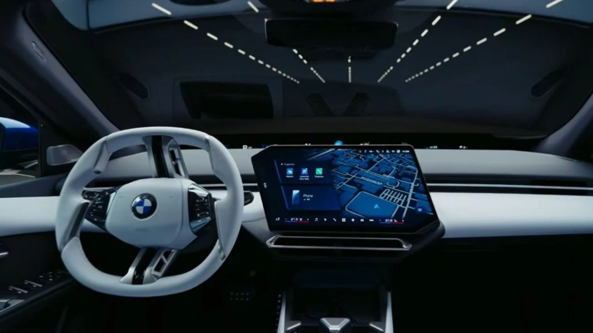 Interiör i nya BMW i3 med stor mittskärm och fyrekrad ratt